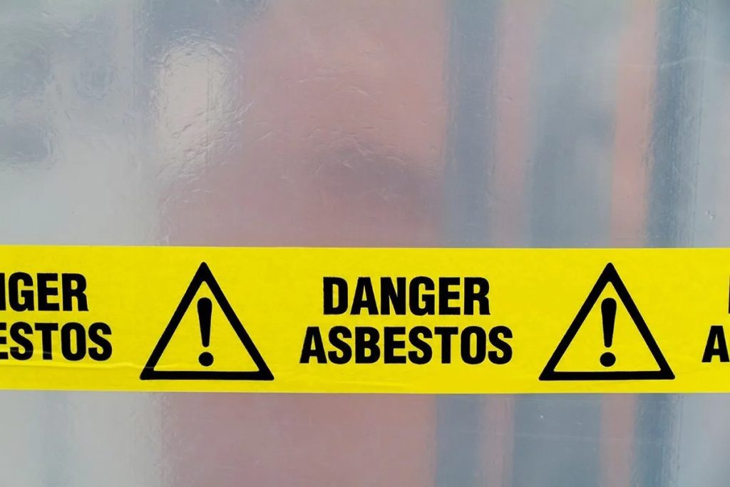 Why was asbestos banned in the UK?